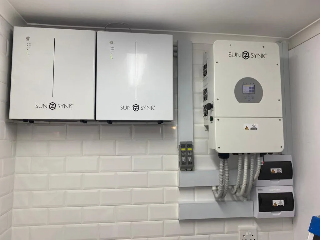 A Sunsynk inverter mounted on a wall in a home installation.
